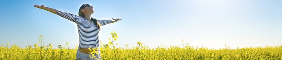 Girl running through open field